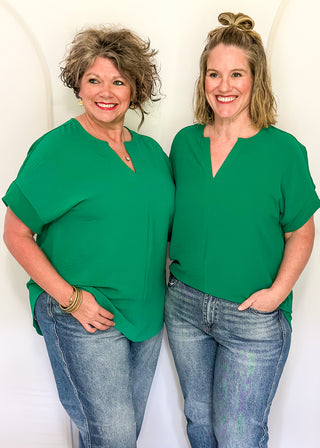 Solid textured blouse with a V-notch neckline, short sleeves
