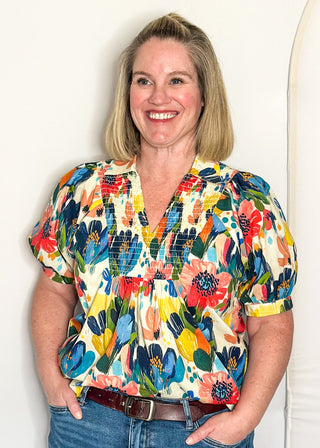 Multicolor floral blouse with smocked detail and short sleeves