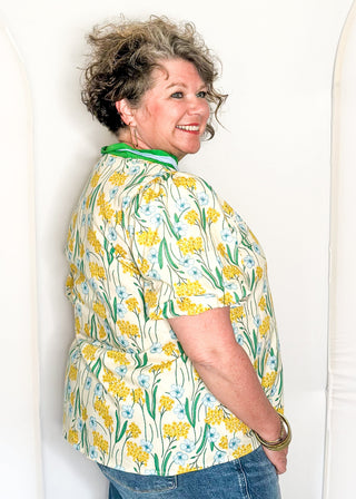 Spring floral top with short sleeves, easy silhouette, and colorful yellow, blue and green.