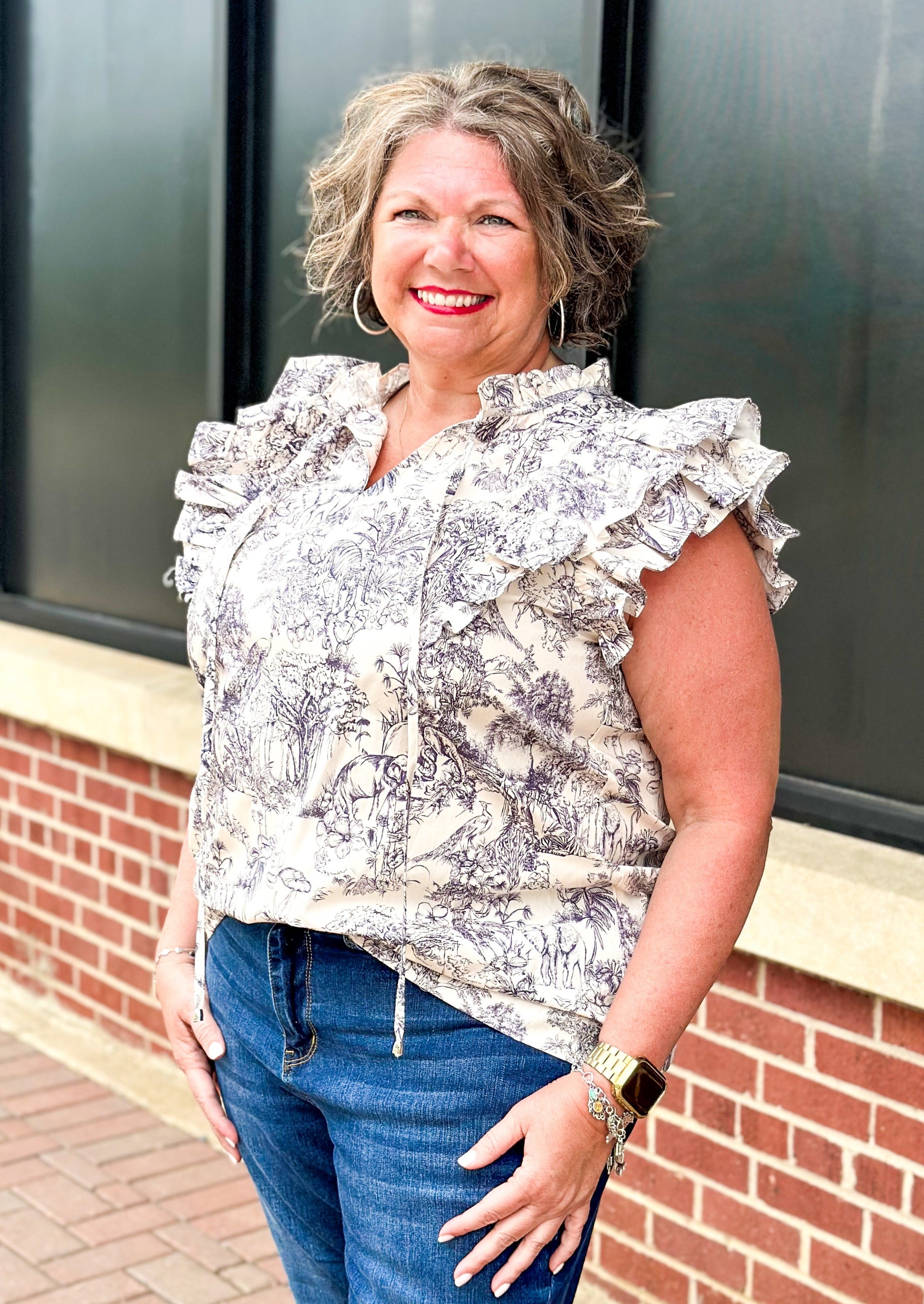 off white double ruffle short sleeve top with ruffle tie v-neck - jungle print scene in a bluish gray