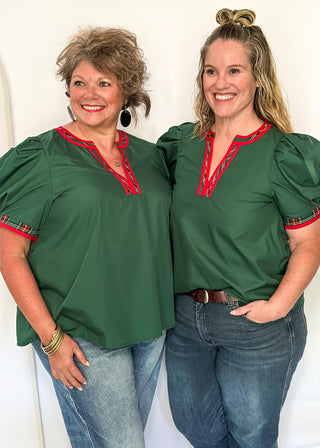 Green puff sleeve top with red plaid contrast neckline and trim detail