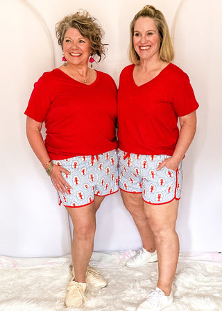 Blue and white stripe lobster print athletic shorts with red trim