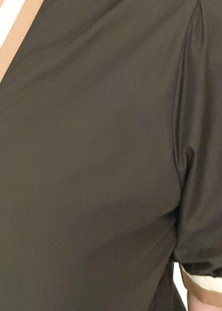 Black short sleeve top with contrast in ivory and beige on the sleeves and notch collar. 