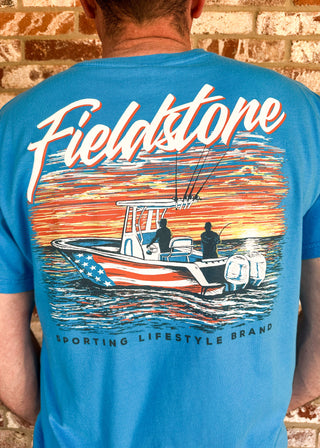 Blue short sleeve tee shirt with front logo pocket and graphic design on the back.