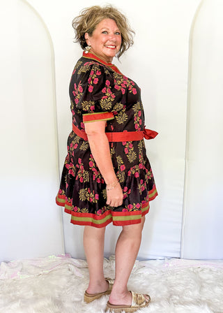 Short sleeve belted dress in black with berry florals and contrast piping.  Button up. 