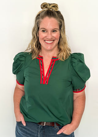 Green puff sleeve top with red plaid contrast neckline and trim detail