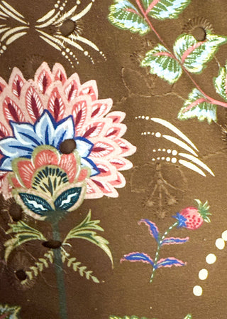 Close up of brown eyelet dress fabric