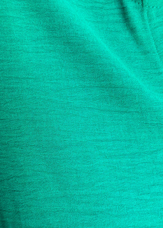 close up of solid textured blouse with a V-notch neckline, short sleeves