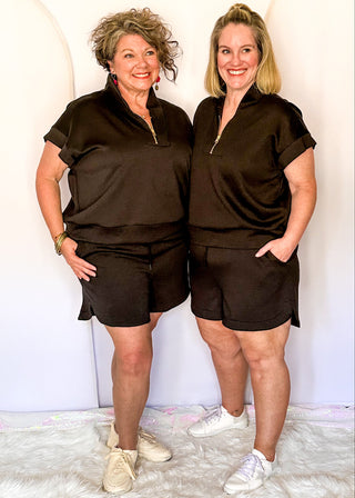 Black drawstring scuba shorts with pockets.