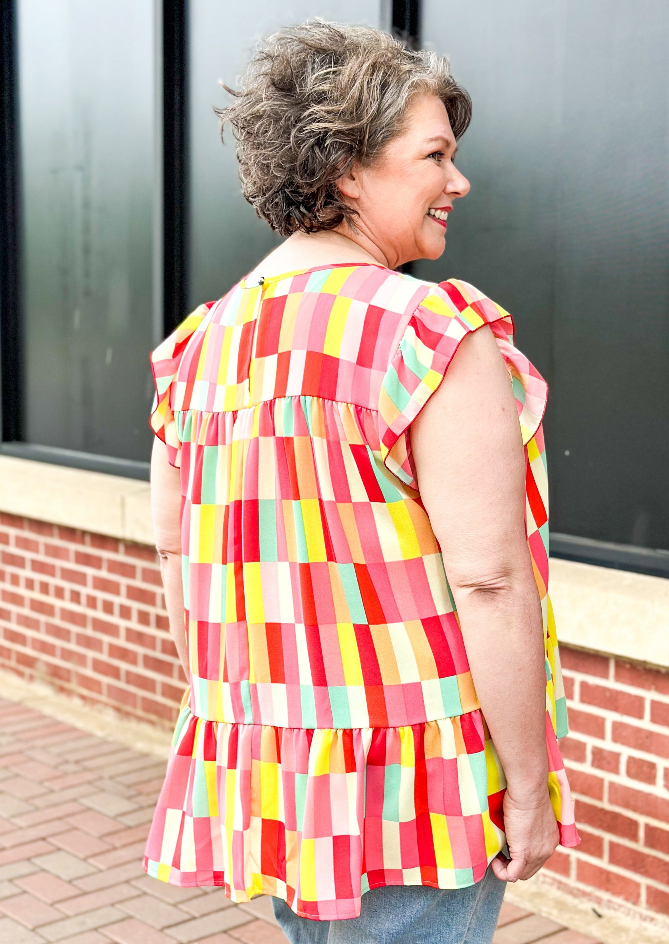 Ruffle Frill Short Sleeve Geometric print top - reds, whites, pinks, yellows, orange and some mint green - round neck - low ruffle - great length