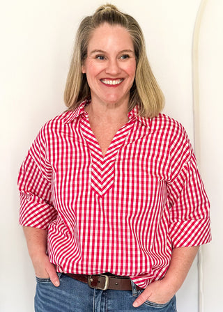 Gingham blouse with split neckline, collar, and 3/4 sleeves.