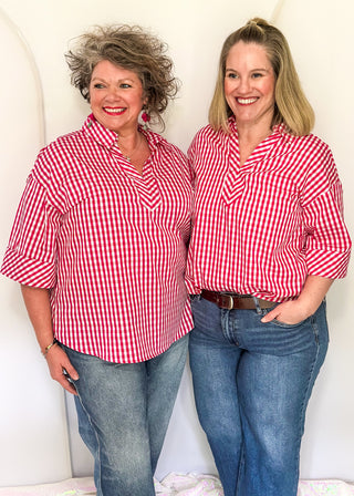 Gingham blouse with split neckline, collar, and 3/4 sleeves.
