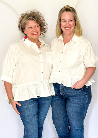 White button-up top with ruffle hem, short sleeves