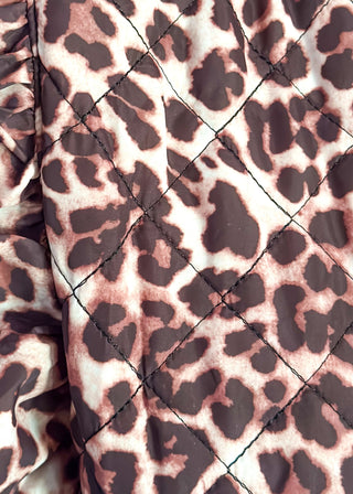 Leopard print Puffer vest with black button closures.  2 front pockets and ruffle detail on the sleeve. 