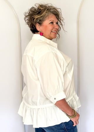 White button-up top with ruffle hem, short sleeves