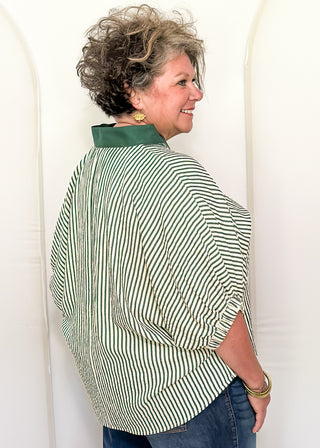 Model wearing a Hunter Green-colored Entro dolman striped top with contrast trim, styled in a relaxed, casual fit.