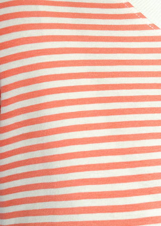 Close up of coral and white stripe short sleeve top with white contrast banding on the collar and sleeves. 