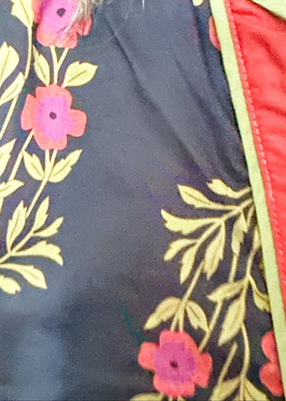 Short sleeve belted dress in black with berry florals and contrast piping.  Button up. 
