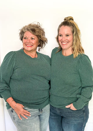 long sleeve ribbed top with cuff sleeve and small puff detail in shoulder. crew neck. 
