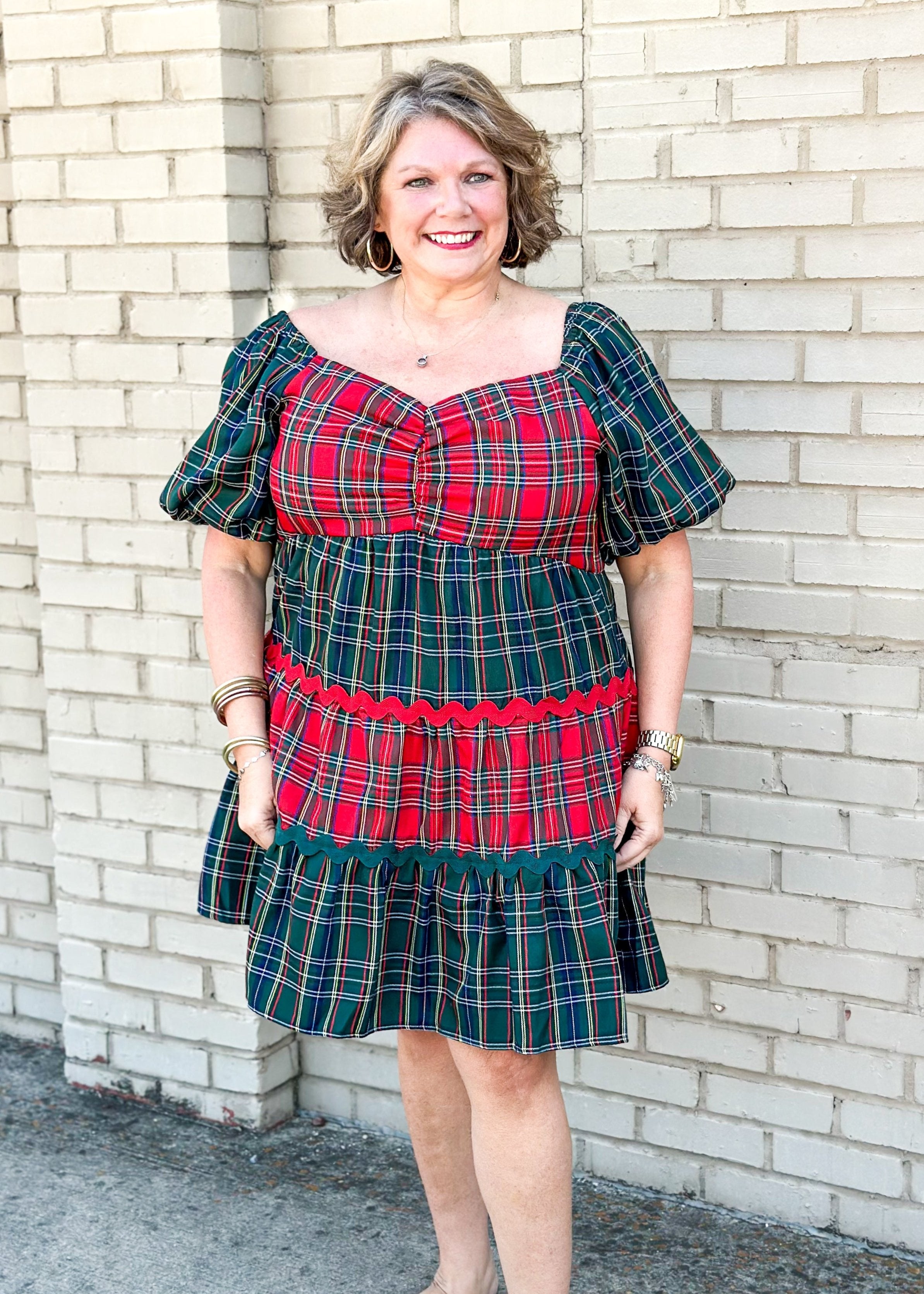 red and green tiered plaid dress - sleeves are green and alternating tiers of red and green plaid with red or green rick rack in between tiers