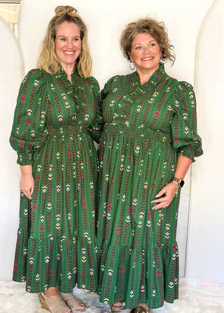 Forest Green Maxi Dress with multi color flower and vine detail throughout.  3/4 length sleeve with smocking around the v-neck, sleeves and waist.  