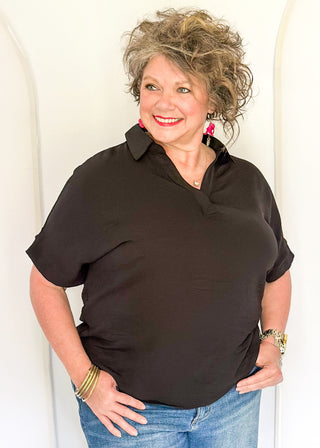 Black collared top with v-neckline