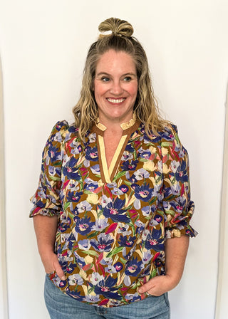 floral top with cream and brown striped detail around collar and v-neck - 3/4 sleeve - browns, blues, magenta, creams, greens, for floral colors