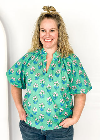 green floral v-neck top with puff short sleeves