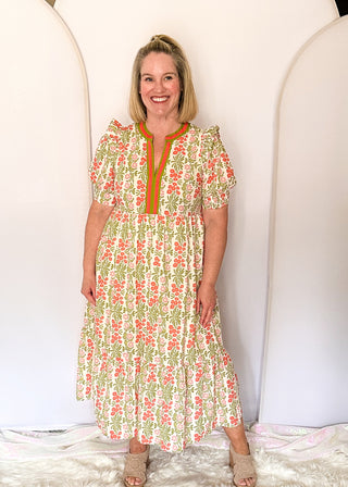 Floral midi dress with contrast neckline, short puff sleeves, and tiered skirt