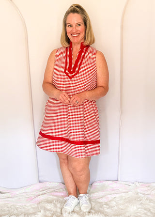 Red gingham sleeveless dress with contrast trim neckline