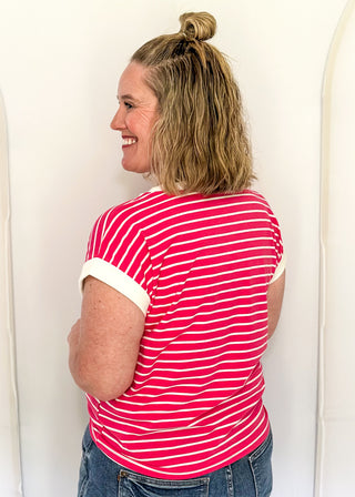wide striped top with cuffed sleeves, and white banded rounded neckline.
