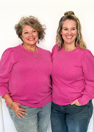 long sleeve ribbed top with cuff sleeve and small puff detail in shoulder. crew neck. 