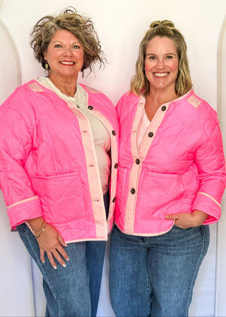 Bright pink quilted jacket with light pink contrast trim, long sleeves, patch pockets, and button-front closure