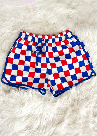 Red, white, and blue checkered shorts with drawstring elastic waist and pockets.