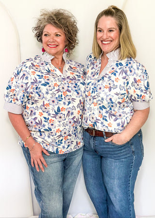 Women’s floral blouse with button front detail and lavender striped contrast accents
