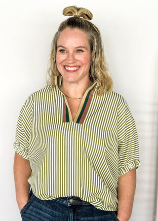 Short sleeve vertical striped shirt in olive.  V-neck ribbon collar. 