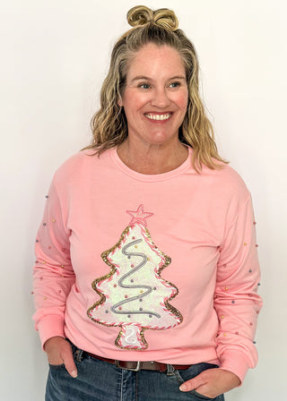 Light pink long sleeve top with sequin Christmas tree appliqué and beaded sleeve accents