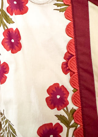 Short sleeve top in ecru with wine floral bundles with olive green leaves.  Collar contrast detail in wine and beige with small scallop trim.