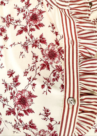 Ivory with small rust colored florals-short sleeve button up top. Rust and ivory stripe ruffle collar and sleeve binding.  