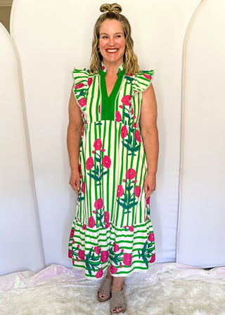 Green and white striped midi dress with pink floral print, flutter sleeves, contrast V-neckline, and a flowy tiered hem