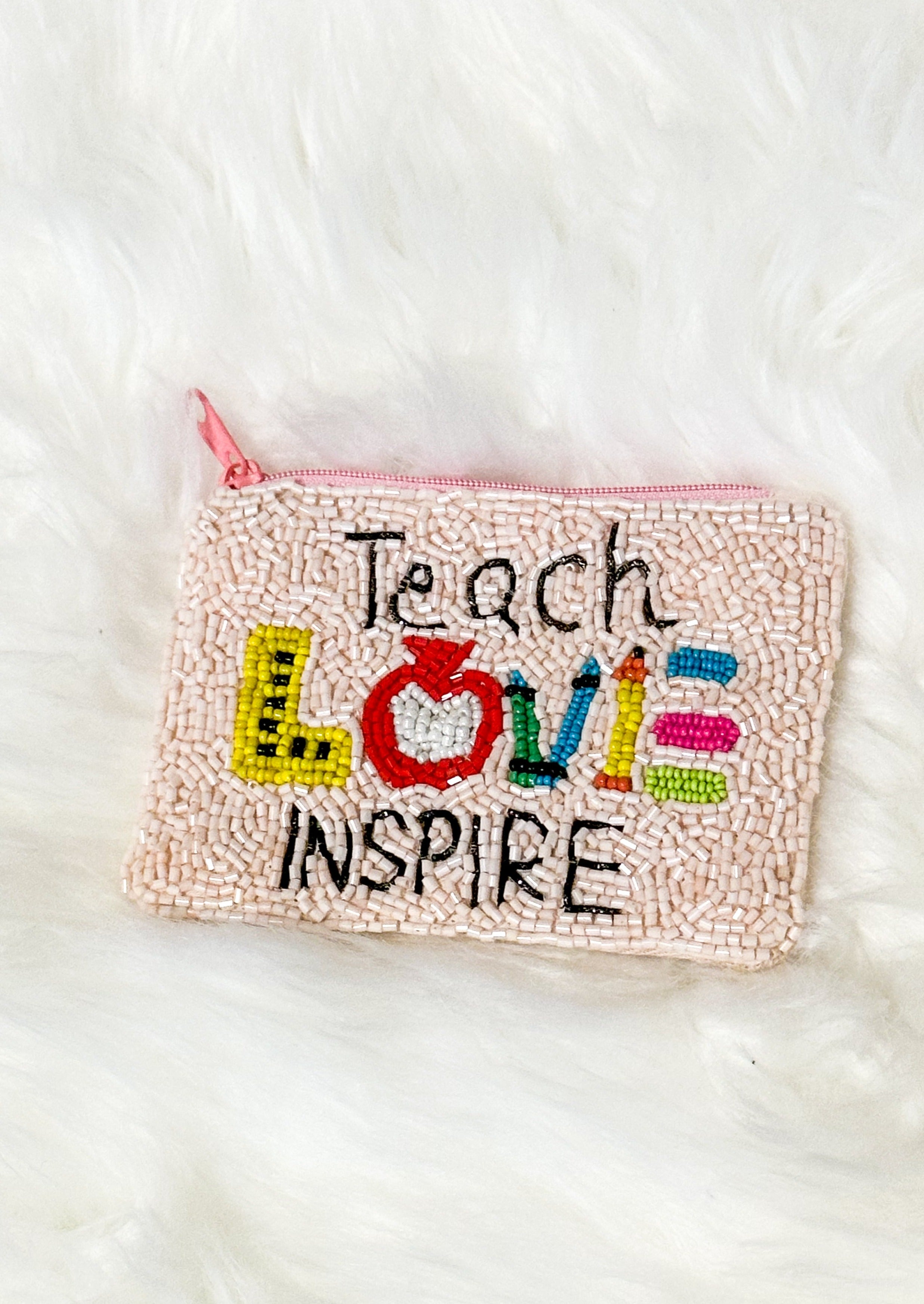Teach Love Inspire Seed Bead Coin Purse - light pink beads with pink zipper - teach and inspire in black beads - love spelled out with a ruler, apple, crayons and pencil