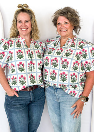 Puff sleeve top with off white background and soft blue grid pattern-large magenta florals with green stems/leaves in each grid-ruffle collar-tie neck