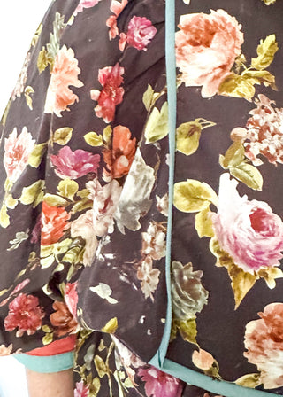 Fall floral Babydoll top with 3/4 puff sleeve, orange and blue strip detail on banding of hem and sleeve. blue ribbon detail on the front and tie at the collar. 