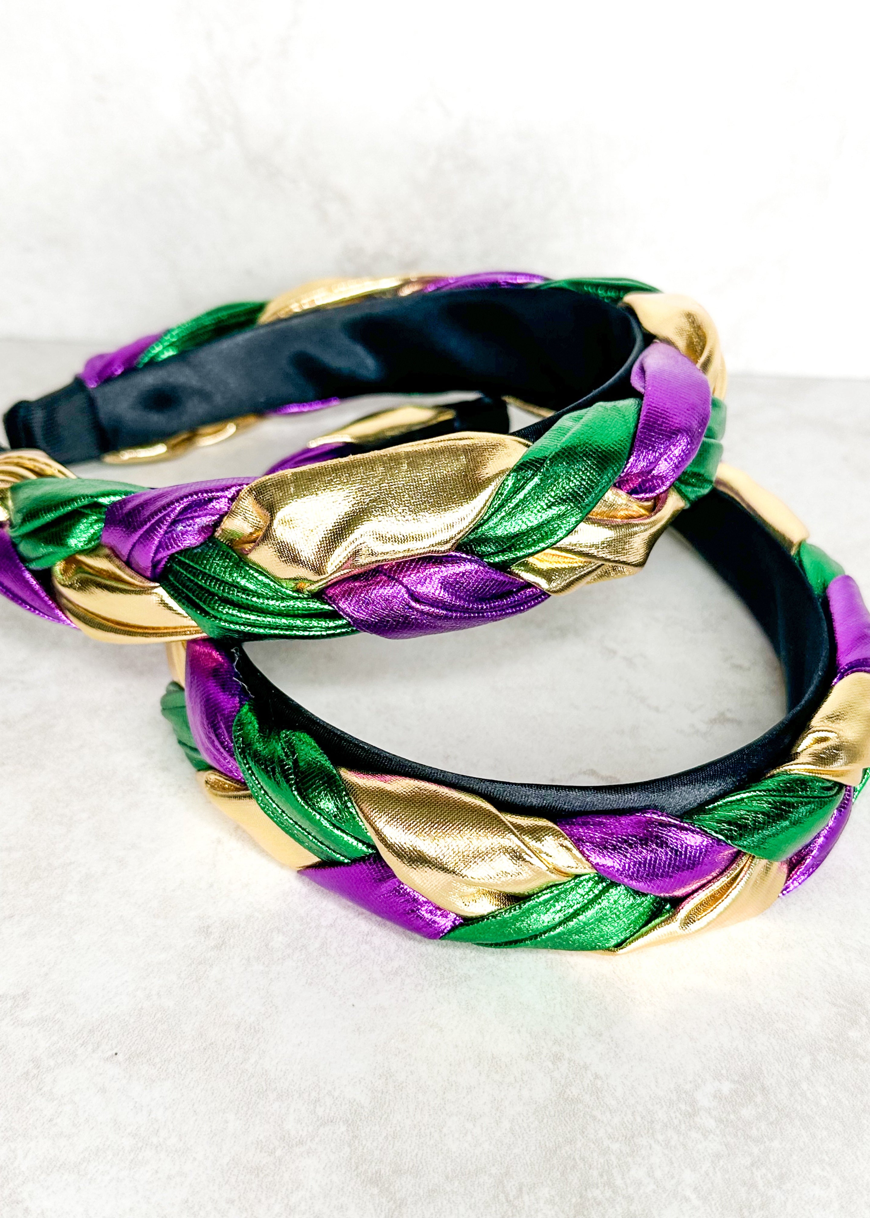 Mardi Gras shiny braided headband with black underside.