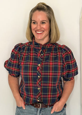 woman wearing a short sleeve button up top in Navy/Red plaid