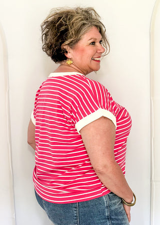 wide striped top with cuffed sleeves, and white banded rounded neckline.