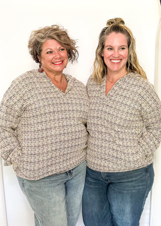 tweed hooded long sleeve top with pockets.  Colors of purple, cream, gray