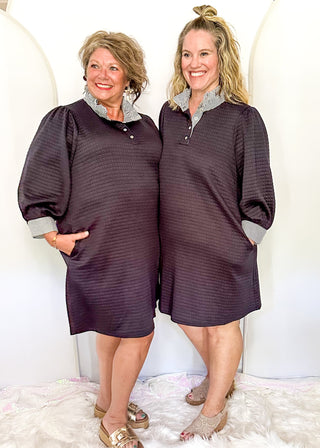 Navy quilted 3/4 length sleeve dress with navy and white stripe ruffle collar and matching sleeve detail.  Knee length