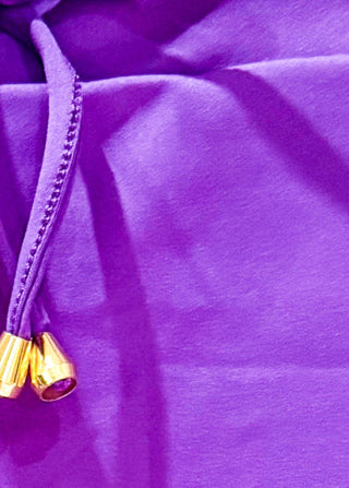 Purple skort with pockets and tie at waist. 