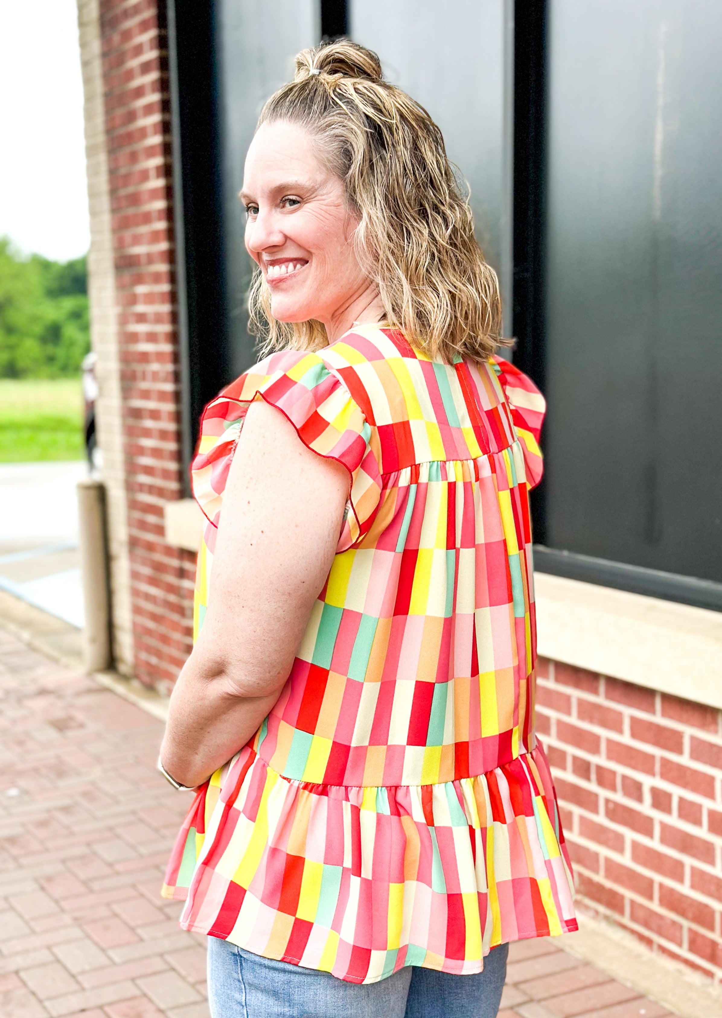 Ruffle Frill Short Sleeve Geometric print top - reds, whites, pinks, yellows, orange and some mint green - round neck - low ruffle - great length